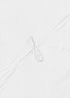 High-resolution white paper texture featuring subtle creases and folds, ideal for backgrounds, design, and overlays. photo