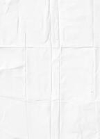 White crumpled paper texture with visible folds, ideal for backgrounds or design elements. photo