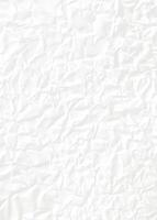 White crumpled paper texture with deep folds, perfect for use as a background or design overlay. photo