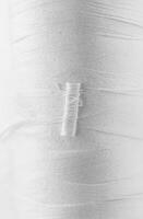 Close-up of White Thread Texture with Soft Fibers and Fine Lines photo