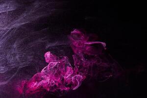 Abstract Dark Pink and Black Ink in Water, Creating Ocean-like Waves and Splashes photo