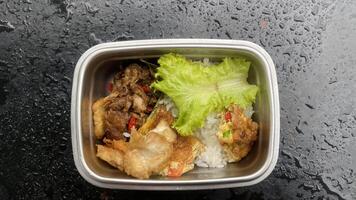 Lunch Box with Fried Tofu egg and Rice photo