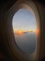 Sunset Flight window view photo