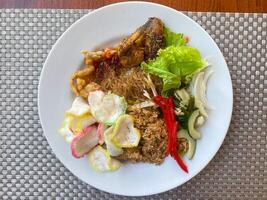 Indonesian Breakfast With Fried Chicken photo