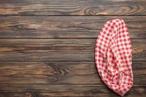 Top View of Red Empty Kitchen Napkin on Table - Folded Cloth for Mockup, Flat Lay, Minimal Style photo