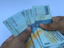 Hand Counting Indonesian Rupiah photo