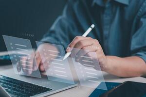 Close-up of hands using a futuristic interface for task management, and digital checklist satisfaction on a laptop. photo