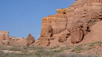 Charyn or Sharyn Canyon on a blue summer sky background in the South of Kazakhstan, near Almaty photo