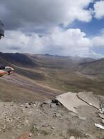 A man standing on a hill photo