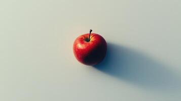 Single Red Apple with Shadow on White Background photo