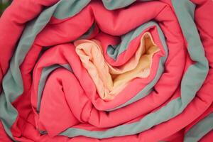 Discover Colorful Rolled Blankets Showcasing Vibrant Textiles for Your Living Space photo