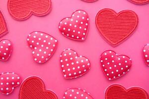 A Vibrant and Colorful Heart Design Set Against a Soft Pink Background for Your Enjoyment photo