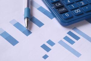 Comprehensive Financial Analysis Tools Advanced Calculator and Informative Graphs on Paper photo