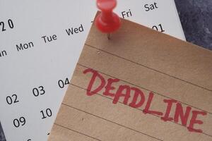 Reminder an important deadline is approaching on your calendar, marked with a pushpin photo