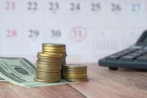Effective Financial Planning Utilizing Coins and Cash with the Help of Calendar and Calculator photo