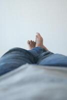 Enjoying the simple pleasure of relaxing my feet on a smooth surface while in casual jeans photo