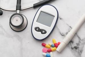 Effective Management Tools for Diabetes Include Stethoscope, Glucometer, and Prescribed Medications photo