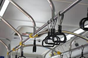 An Interior View Highlighting the Handrails and Grab Bars of a Public Bus for Safety photo