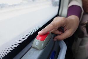 Closeup of Bus bell switch for stop inside the public bus photo