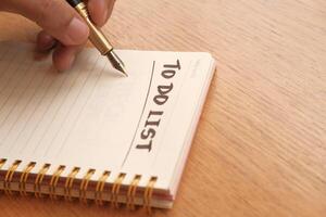 Creating a Hand Written To Do List within a Notebook Using a Pen for Tasks and Ideas photo