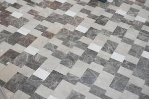 Stunning and Elegant Marble Tile Floor Design Featuring a Variety of Unique Patterns photo