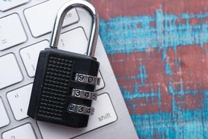 A Combination Padlock on a Keyboard is essential for enhancing Security and Privacy photo