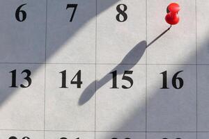 Using a Calendar with a Pin on a Date Boosting Your Planning and Organization Skills photo