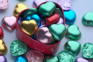 A Beautiful Collection of Colorful HeartShaped Chocolates Nestled in a Decorative Heart Box photo