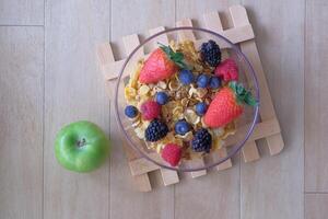 A Vibrant and Colorful Fruit and Cereal Breakfast Bowl Featuring a Crisp Green Apple photo