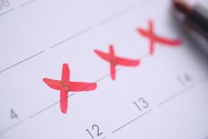 The Calendar is Marked with Red Crosses Indicating Important and Significant Dates photo