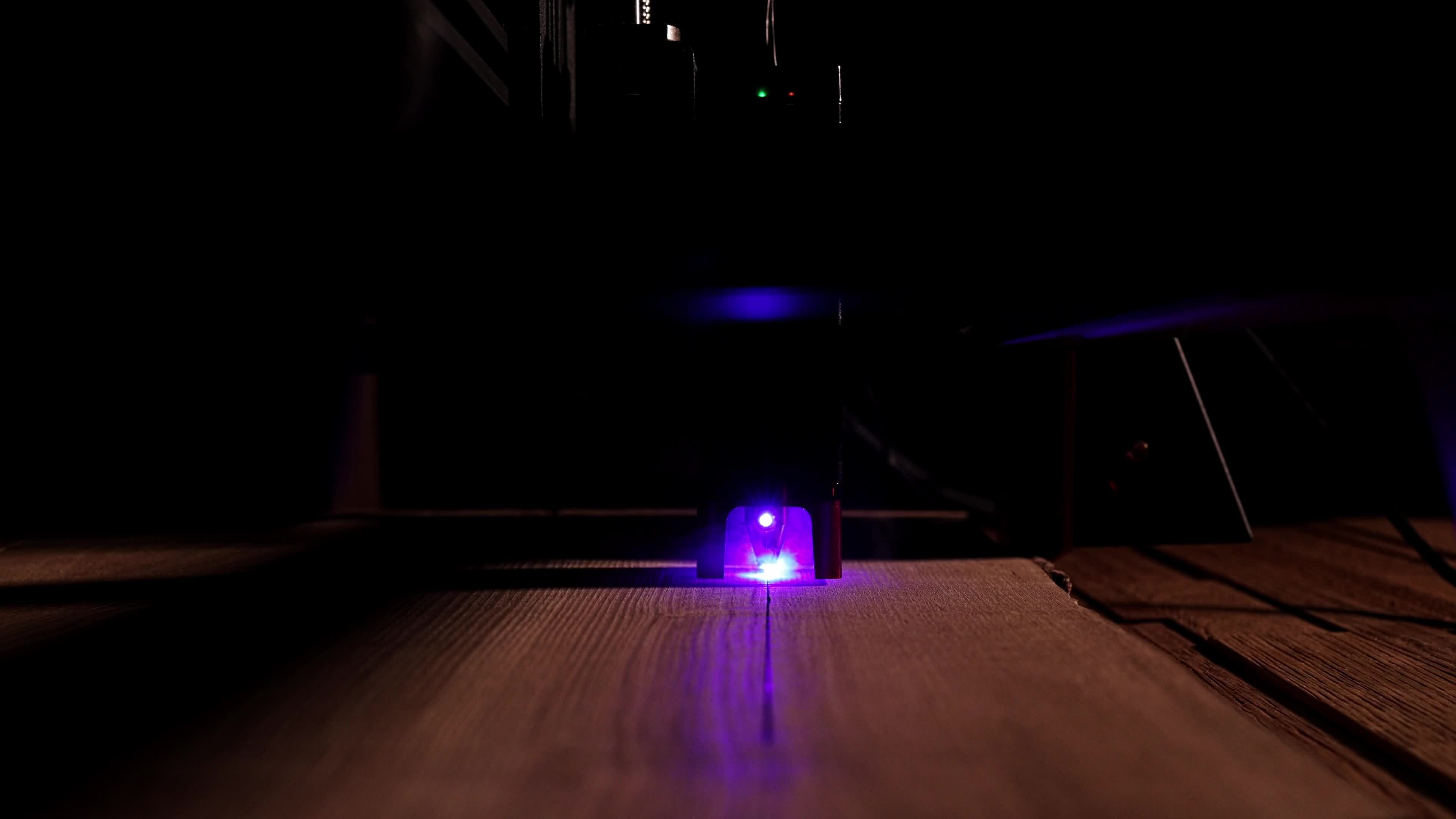 The process of laser wood cutting. A laser machine precisely carves