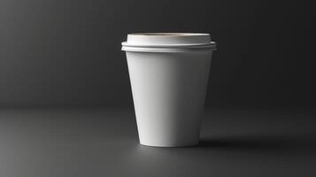 A white coffee cup with a lid sits on a dark table photo