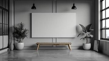 A white wall with a large blank canvas and a wooden bench in front of it photo