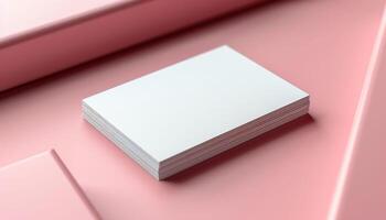 A white business card is on top of a stack of white business cards photo
