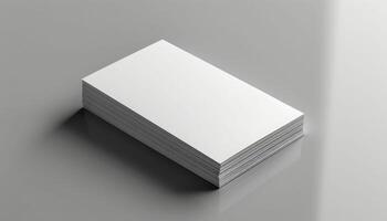 A stack of white business cards sits on a table photo