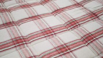 The soft and inviting red and white checkered fabric texture creates a cozy atmosphere video