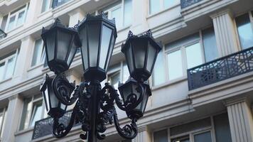 Beautifully designed street lanterns enhance the view against a backdrop of modern architecture video
