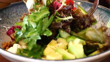 A Fresh and Colorful Salad Bowl featuring Delicious Avocado along with various Toppings video