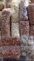 many mixed nuts in a plastic packet on shelf video
