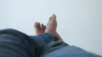Enjoying the simple pleasure of relaxing my feet on a smooth surface while in casual jeans video