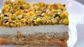 This is a delicious and enticing layered dessert featuring an array of nuts and creamy goodness video