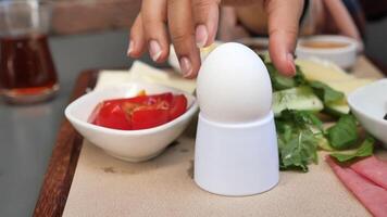 A beautifully arranged Breakfast Table featuring Egg, Fresh Vegetables, and various Condiments video