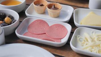 An assortment of delicious Breakfast Items beautifully arranged on a rustic Wooden Table video