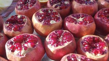 A Vibrant Display of Freshly Cut Pomegranates at a Local Market for Everyone to Enjoy video