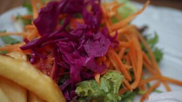 A Fresh and Colorful Salad packed with Crispy Carrots, Crunchy Cabbage, and Fresh Greens video