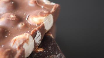 A Closeup View of Delicious Chocolate Bars Filled with Crunchy Nuts and Soft Marshmallows video