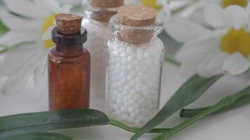 Homeopathic pills containers on a table video