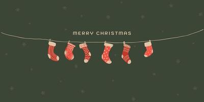 Various red socks hanging hand drawn childish style on green background graphic illustration. Merry Christmas greeting card rectangle template. vector