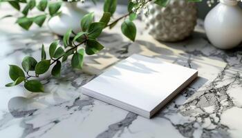 A white piece of paper sits on a marble countertop photo