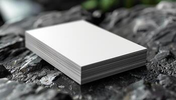 A stack of white paper is on a rock photo